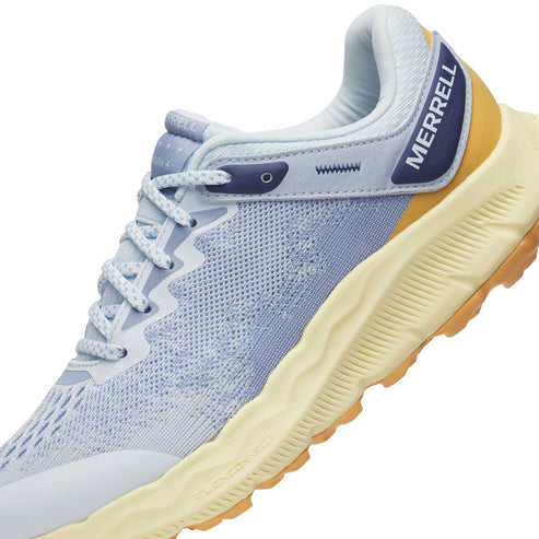 A blue athletic shoe with the word MERRELL printed on it.