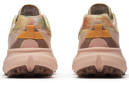 Pair of running shoes with tie dye uppers, pink midsoles, and orange accents, viewed from the back.