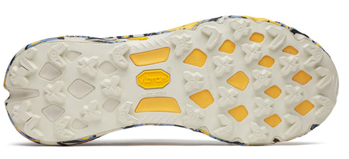 The sole of a shoe with a Vibram logo, showing a white and yellow tread pattern.