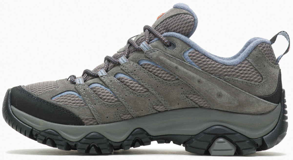 A gray and light blue hiking shoe viewed from the side, featuring a mesh and suede upper, a black rubber toe cap, a sturdy dark gray midsole, and a rugged black outsole with a pull tab on the heel.