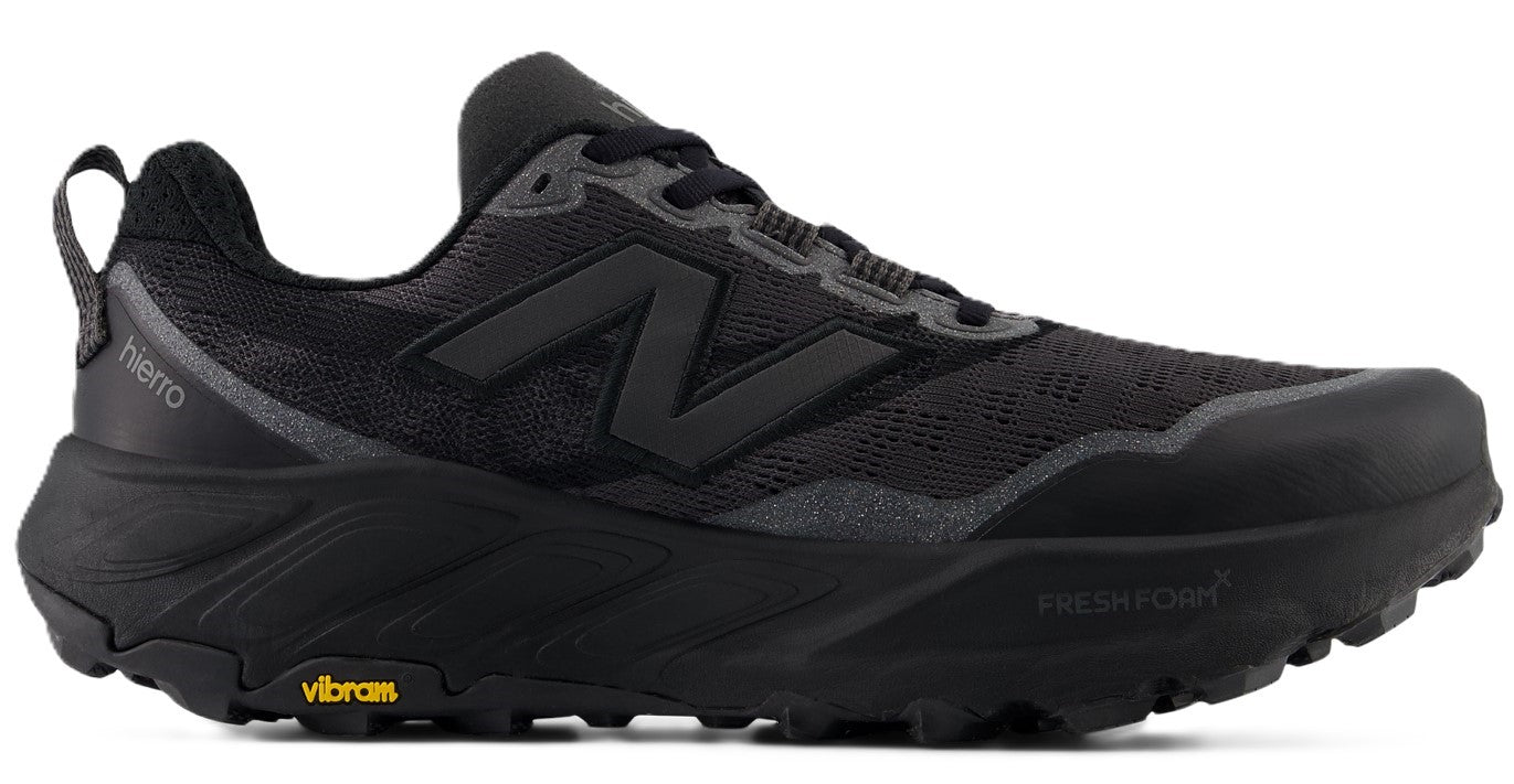A black trail running shoe featuring a dark gray logo on its side, a thick sole, and the word "hierra" on the side.