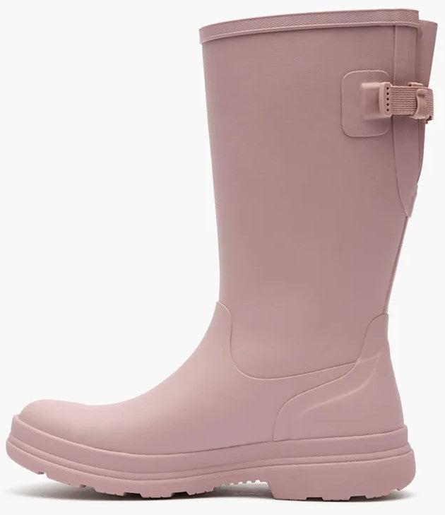 A solid, light pink mid-calf rain boot with a matte finish and a matching buckle strap detail on the side.