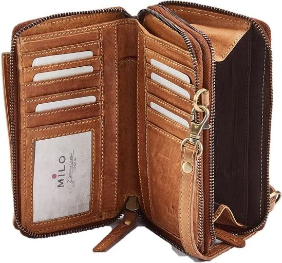 Open brown leather wallet with multiple card slots, zippered compartments, and wrist strap, featuring a clear ID window with "MILO Genuine Leather Collection" text.