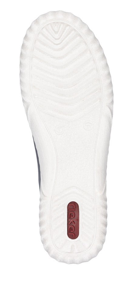 White shoe sole with patterned treads and a small red oval with white text.