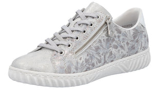 Silver sneaker with floral pattern and side zipper.