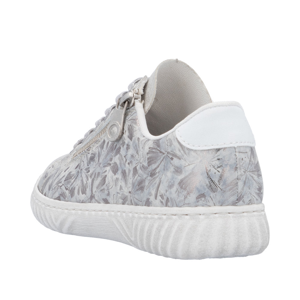 Low-top sneaker with textured white sole, all-over grey floral pattern, side zipper, and white heel patch.