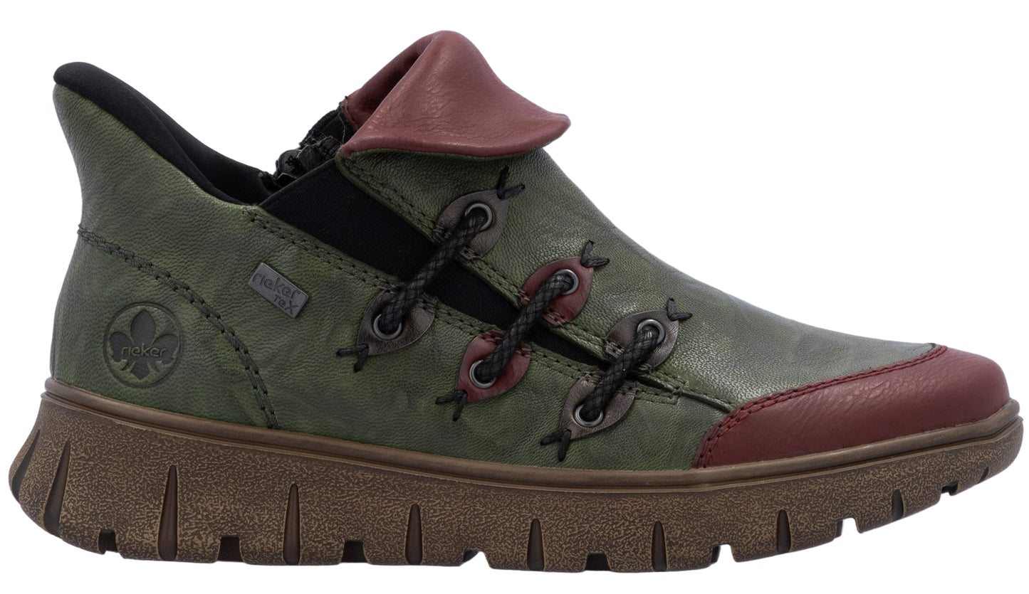 Olive green casual shoe with burgundy accents, decorative laces, and a thick, ridged sole.