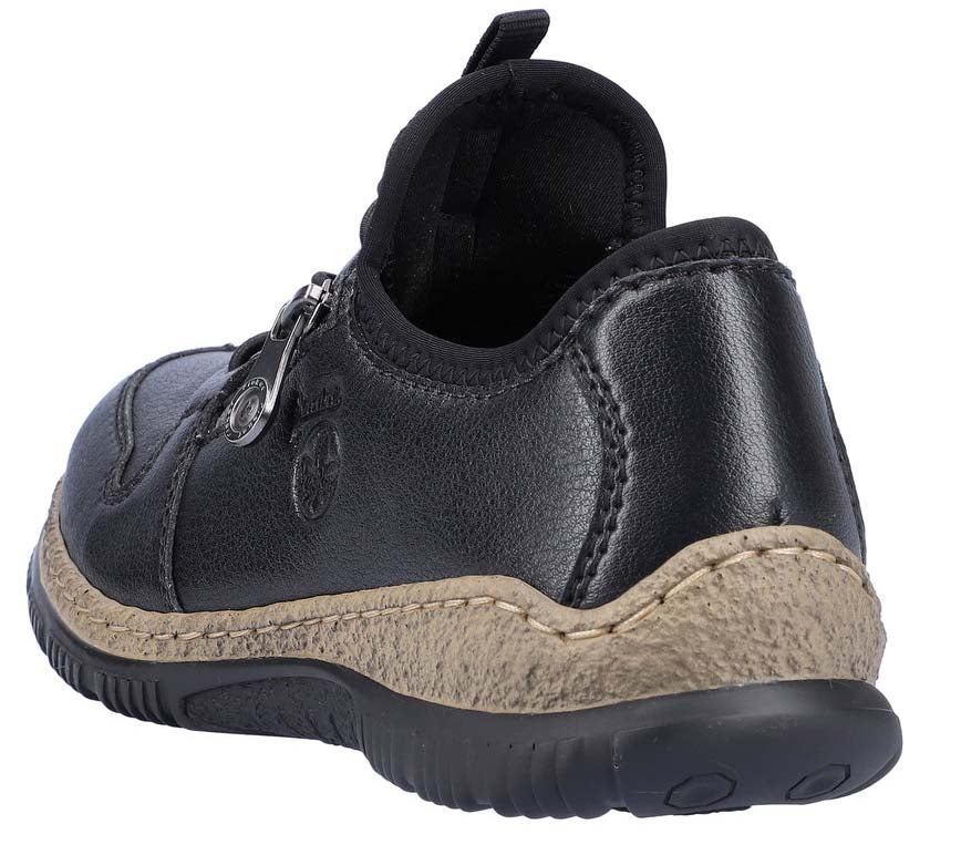 Low top black shoe with decorative zipper.