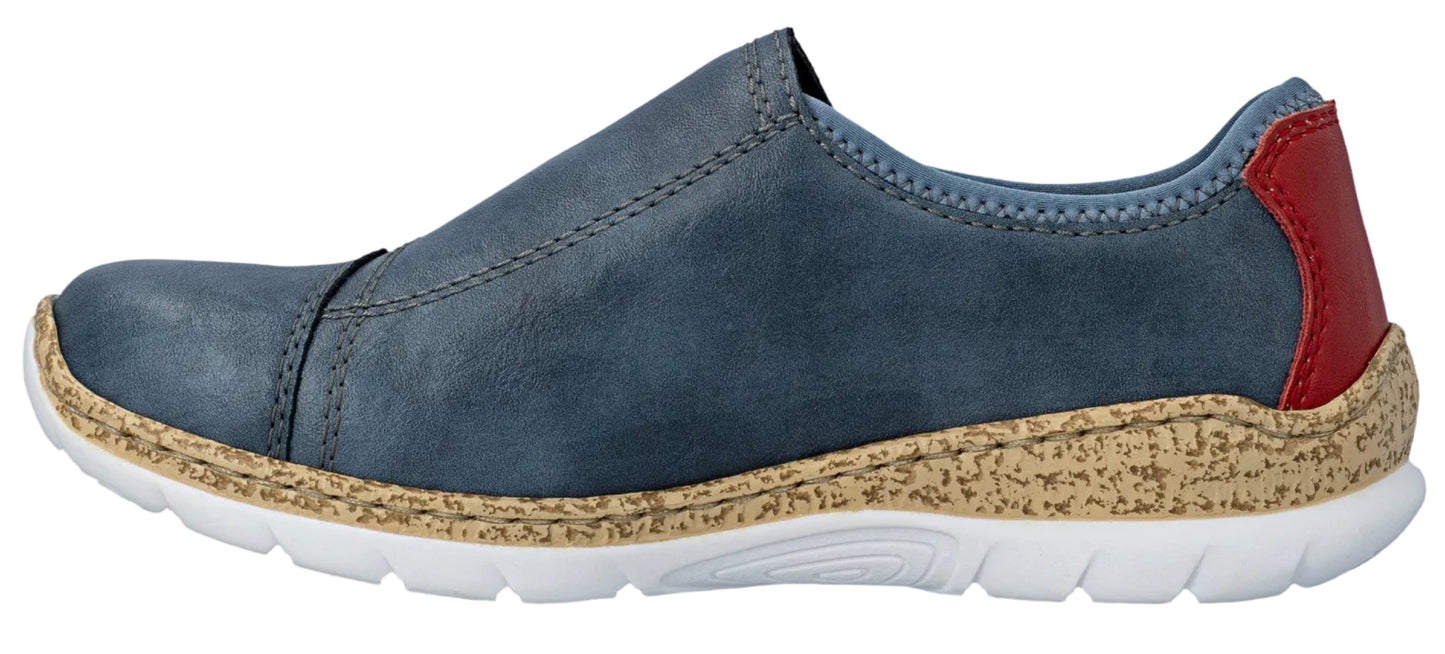 A slip-on shoe with a blue upper, red heel, speckled midsole, and white sole.