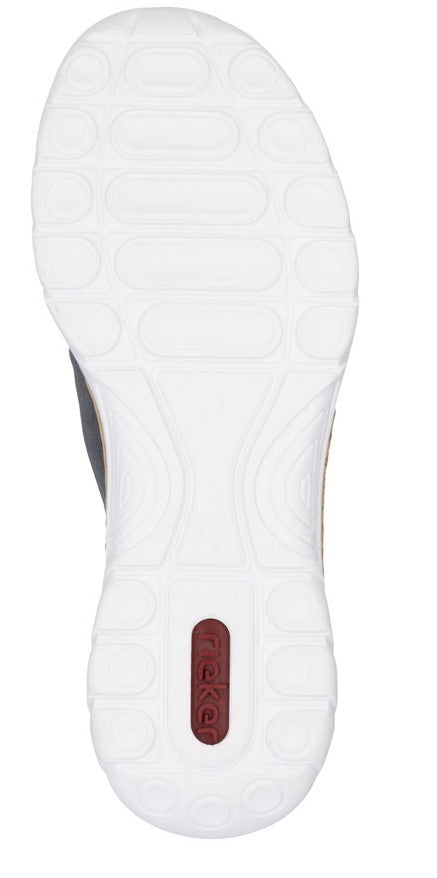 A white shoe sole with textured design and a small rectangular piece displaying the text "RIEKER".