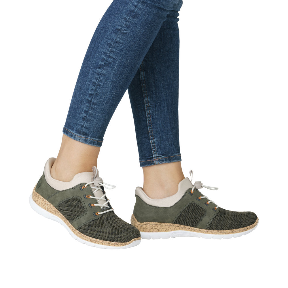Low cut olive green athletic shoes with white laces and soles.