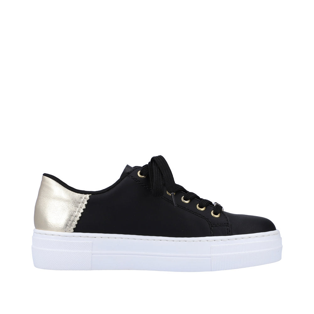 A black sneaker with gold heel on a thick white sole with laces.