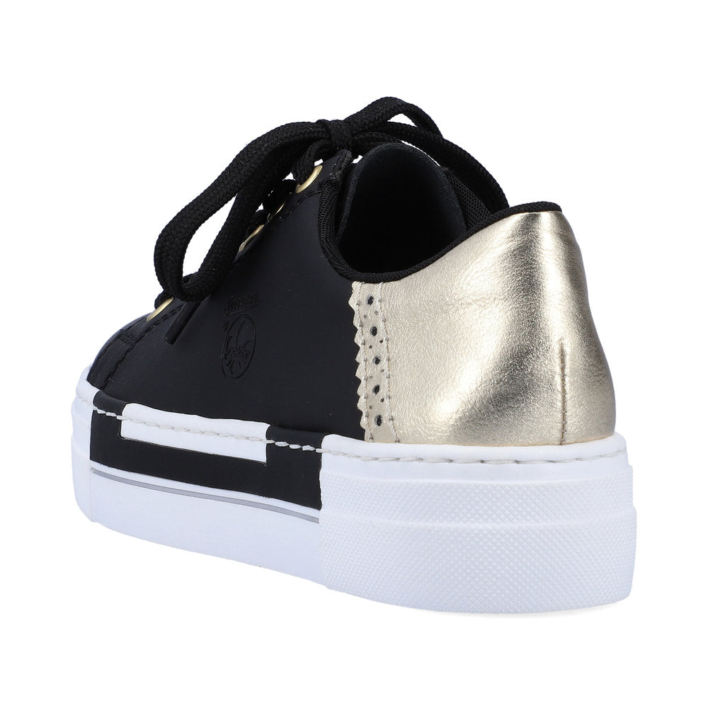 A black and gold platform tennis shoe with black laces.