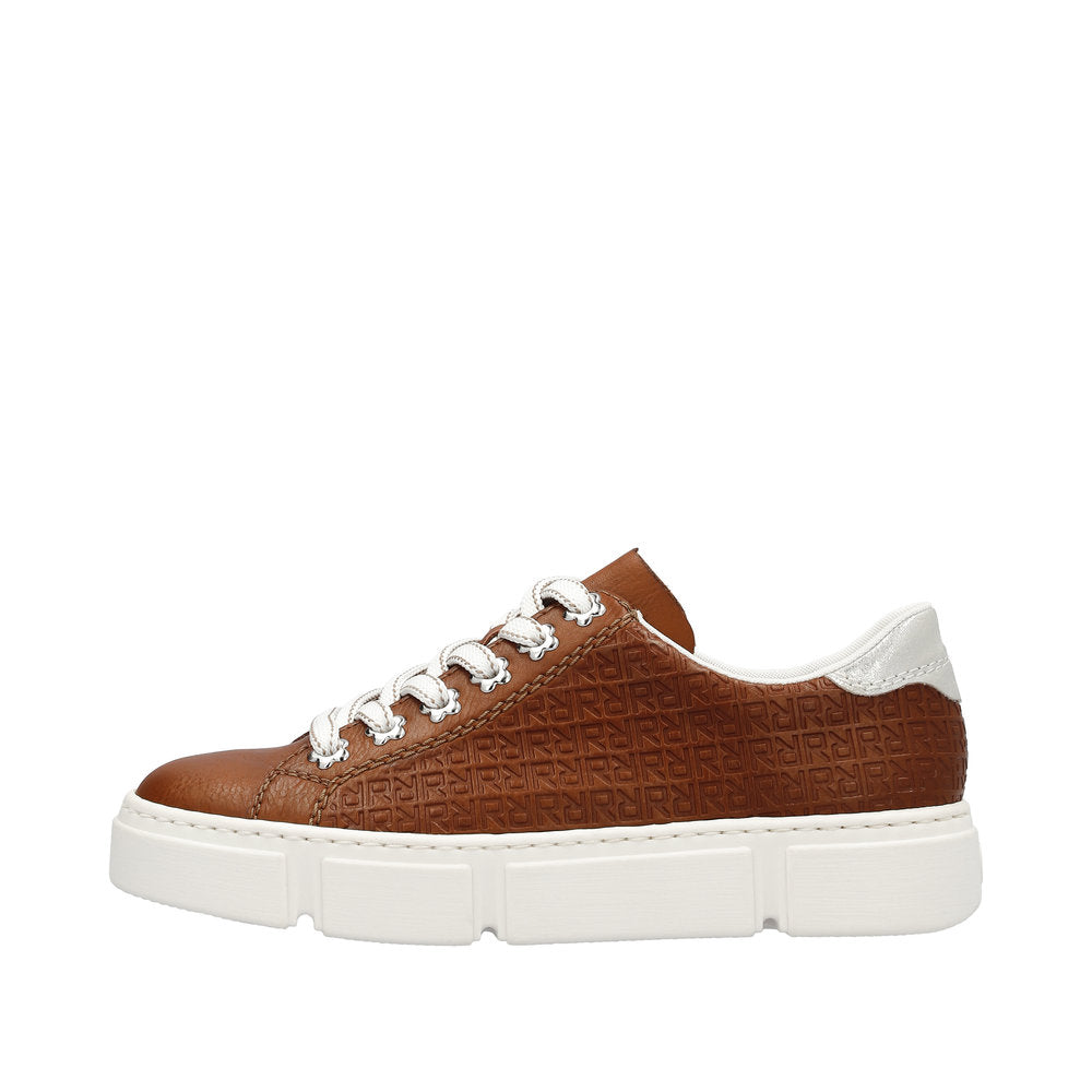 A brown leather sneaker with a white sole and laces.