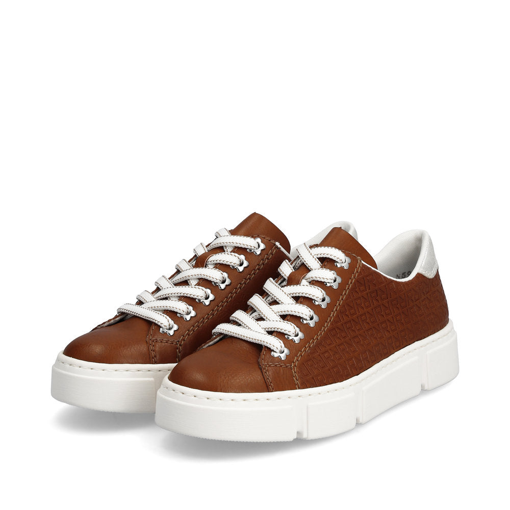 A pair of brown low-top sneakers with white laces and soles.