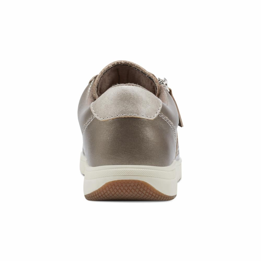 Rear view of bronze low-top sneaker with zipper.