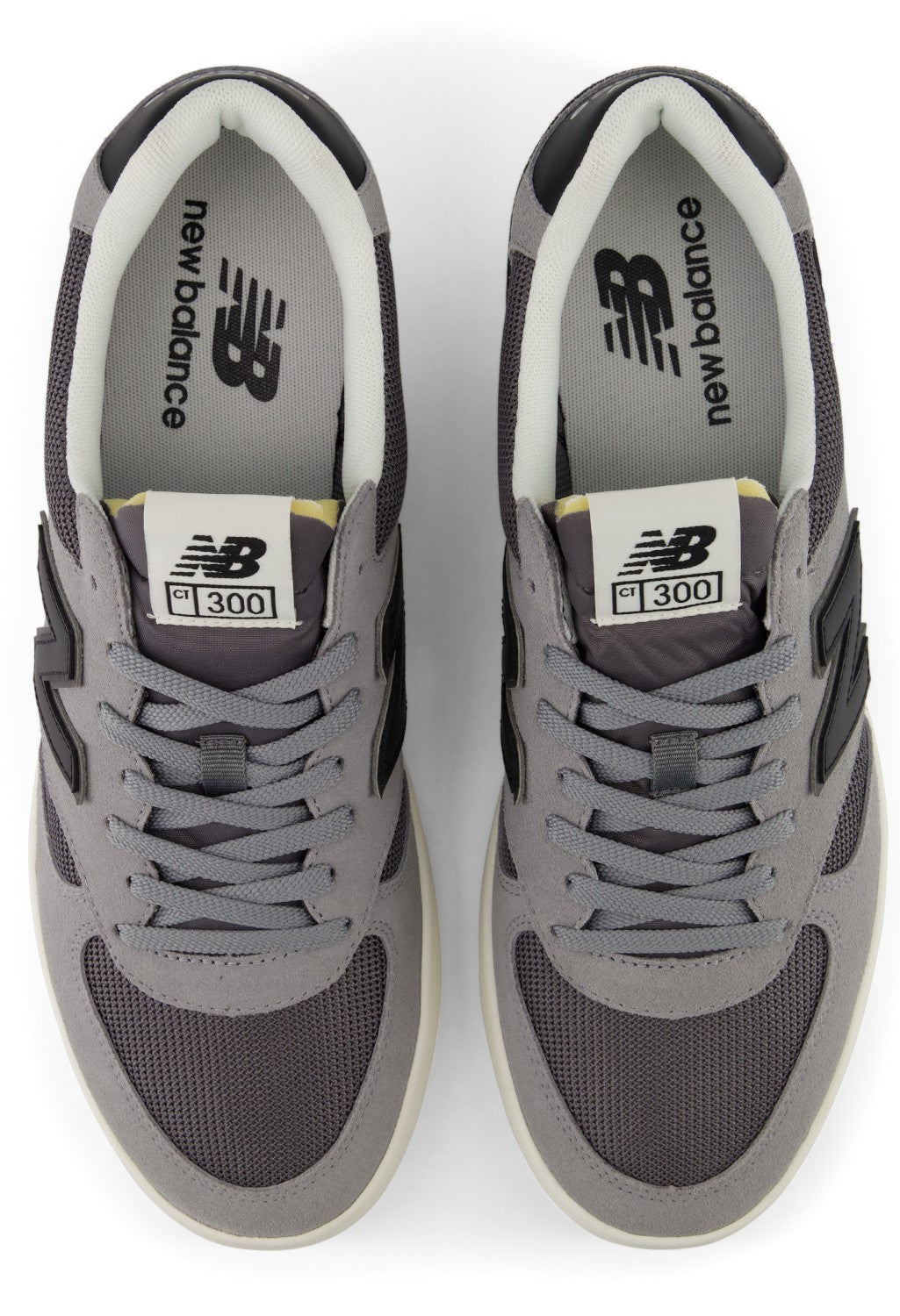 A pair of grey New Balance CT 300 sneakers viewed from directly above, showing the mesh and suede construction, laces, and branded tongue and insole.