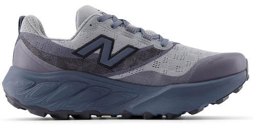 A gray and dark navy trail running shoe featuring a breathable mesh upper, a dark navy logo on the side, a chunky midsole with sculpted lines, and a rugged, high-traction lugged outsole.
