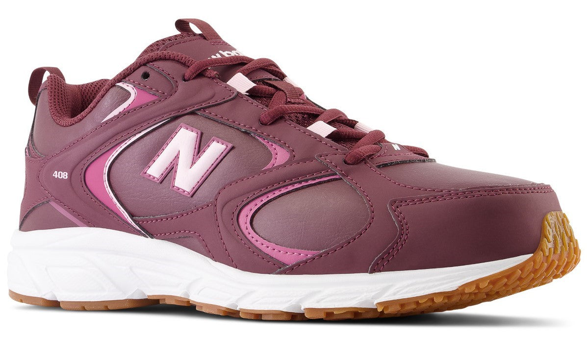 A plum-colored athletic sneaker with a white midsole and gum-colored outsole, featuring a pink letter N logo on the side and the number 408 printed near the heel.