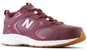 A plum-colored athletic sneaker with a white midsole and gum-colored outsole, featuring a pink letter N logo on the side and the number 408 printed near the heel.