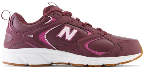 A New Balance 408 athletic shoe in a deep burgundy color with light pink accents on the logo, midsole details, and tongue, featuring a thick white midsole and a brown gum rubber outsole.