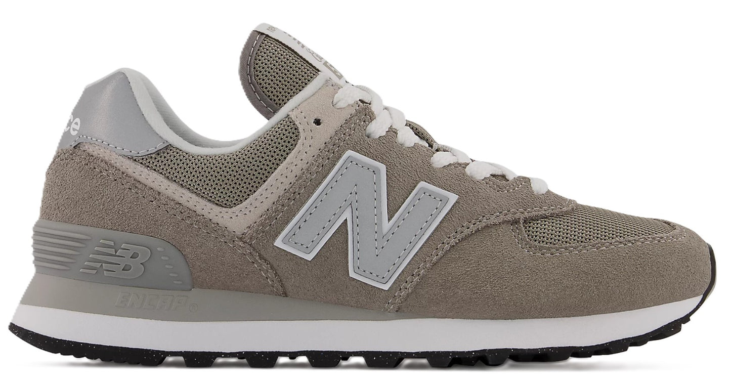 A gray suede and mesh sneaker with a large 'N' logo on the side.