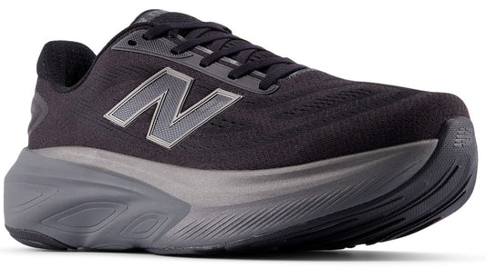 A black athletic shoe with a gray New Balance logo on the side and a thick gray sole.