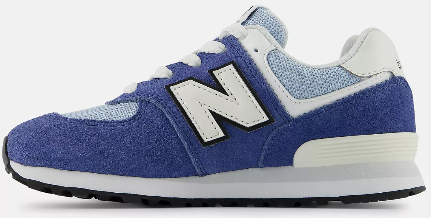 A blue suede and mesh sneaker with a white 'N' logo and white laces.