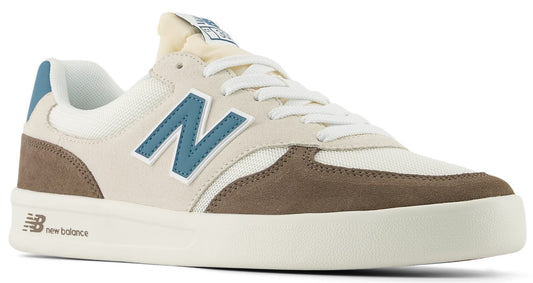 Low-profile sneaker with white laces, blue 'N' logo, brown suede accents, and a white sole.