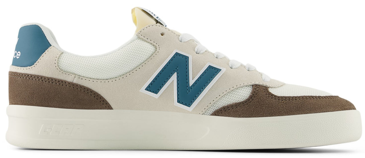 A low-top sneaker with beige, brown, and blue accents.
