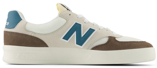 A low-top sneaker with beige, brown, and blue accents.