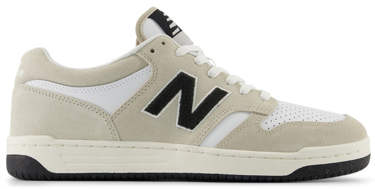 Low-top sneaker with tan suede overlays, white leather accents, and a black 'N' logo on the side.