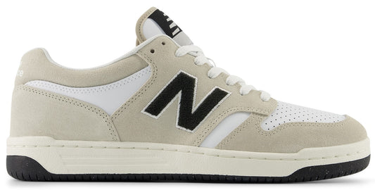 Low-top sneaker with tan suede overlays, white leather accents, and a black 'N' logo on the side.