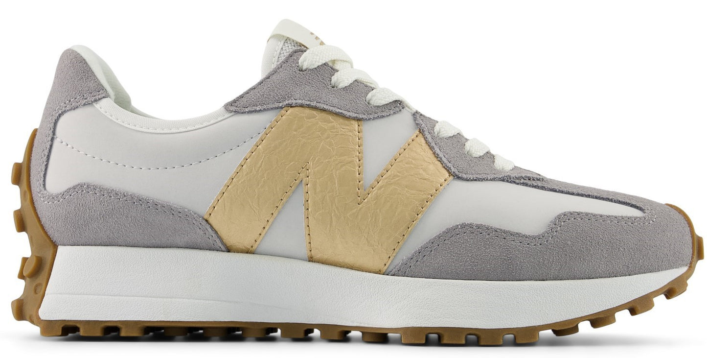 A running shoe with a white and gray upper and brown sole.