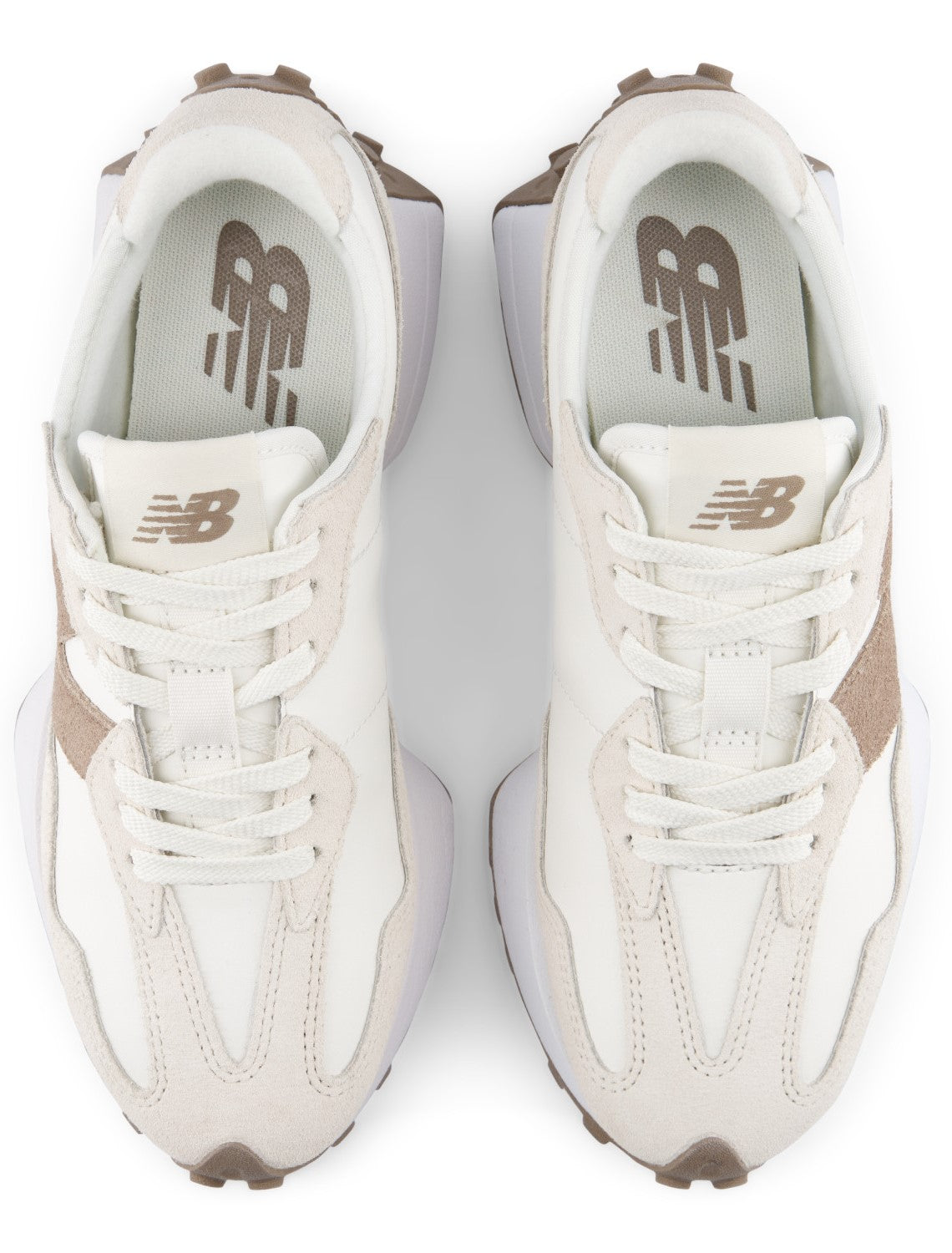 A pair of beige and off-white athletic sneakers with a prominent brown N logo on the tongue, viewed from a top-down perspective.