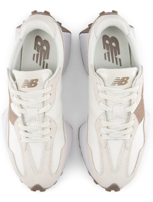 A pair of beige and off-white athletic sneakers with a prominent brown N logo on the tongue, viewed from a top-down perspective.