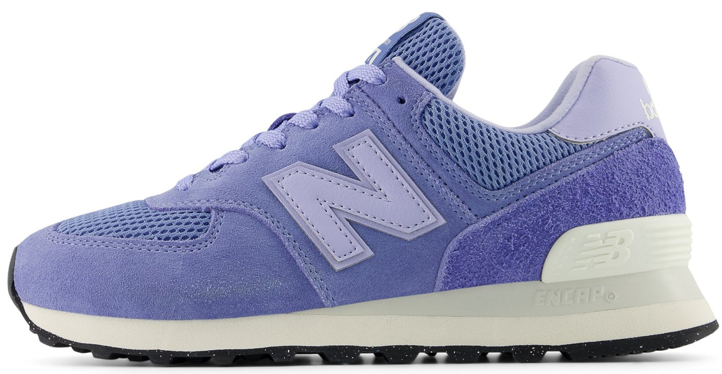 Lavender sneaker featuring the letter N on its side.