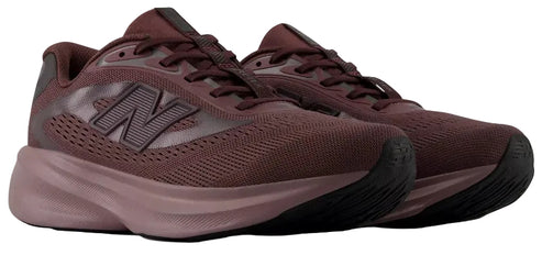 A pair of maroon New Balance running shoes with a mesh upper, thick cushioned midsole, and black textured rubber outsole.