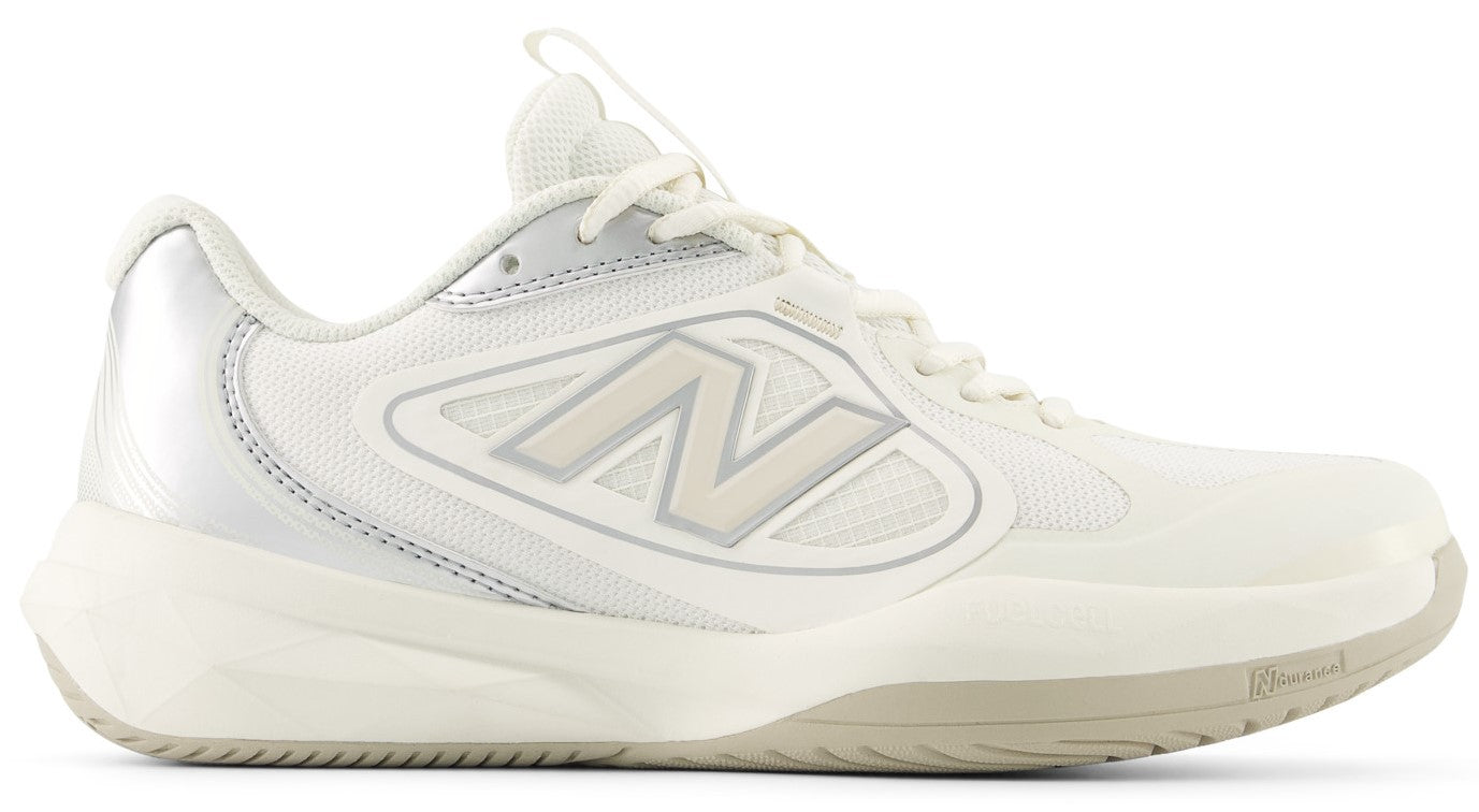 A low-top athletic shoe in shades of off-white and cream, featuring a mesh upper, synthetic overlays, a prominent letter N on the side, a cushioned midsole, and a silver-toned heel tab.