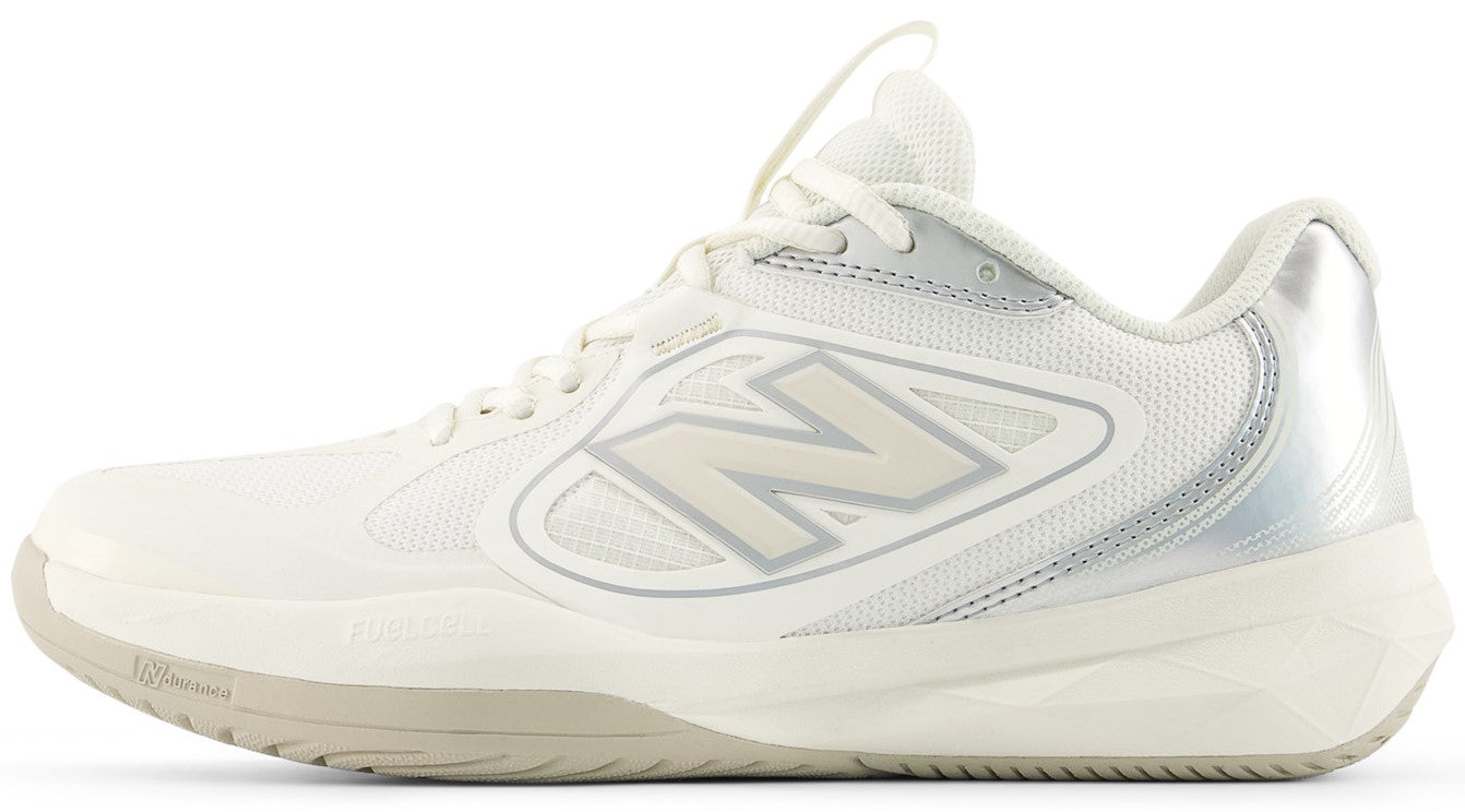 A low-top white athletic shoe with a metallic silver heel tab, a prominent off-white stylized N logo on the side, and a light tan rubber outsole.