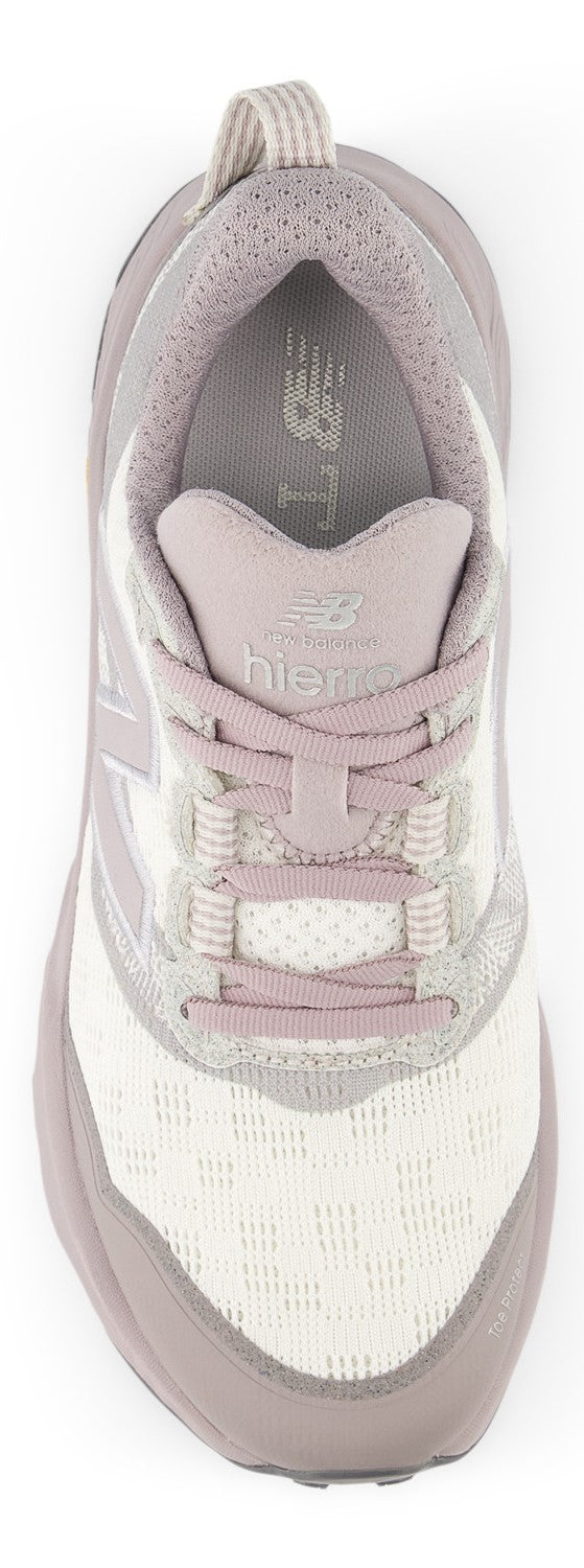 A top-down view of a light purple and white athletic trail running shoe with a mesh upper, laces, and branding on the tongue.