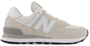 Athletic shoe, off-white suede overlays, white mesh underlays, white 'N' logo, gray heel support, white laces, black and white sole.