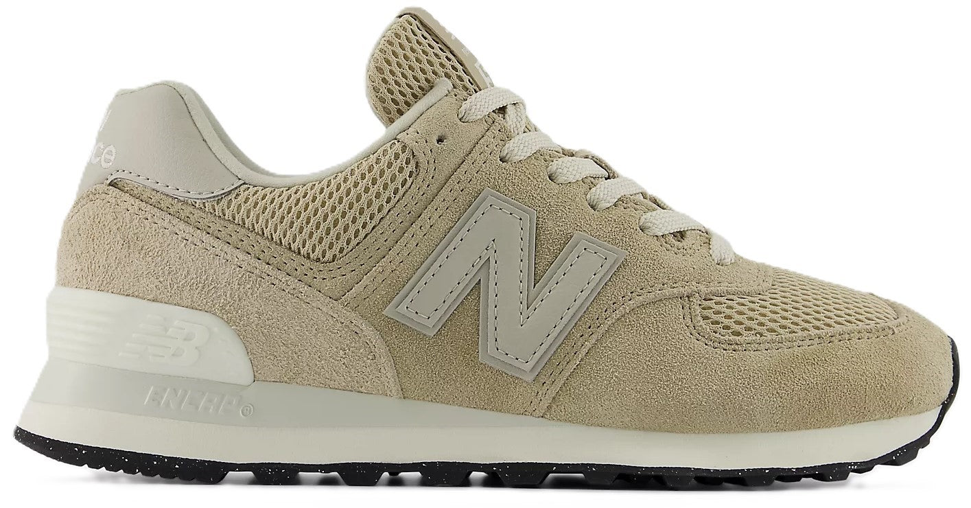 Tan suede sneaker with a cream-colored 'N' logo, white laces, mesh panels, and a black and white speckled sole.