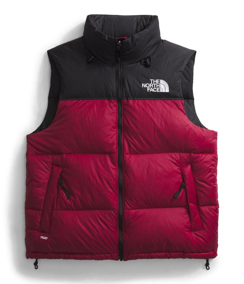 Red and black down vest with a high collar and 'THE NORTH FACE' logo.