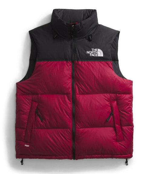 Red and black down vest with a high collar and 'THE NORTH FACE' logo.