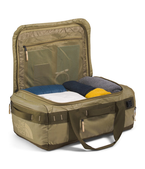 Open olive duffel bag with clothing inside, and interior mesh pocket with zippered closure.