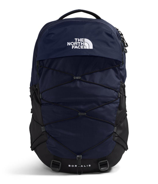 A navy-blue backpack with the words THE NORTH FACE printed in white on the top. The word BOREALIS is printed in white at the bottom. The backpack has adjustable straps and bungee cords.