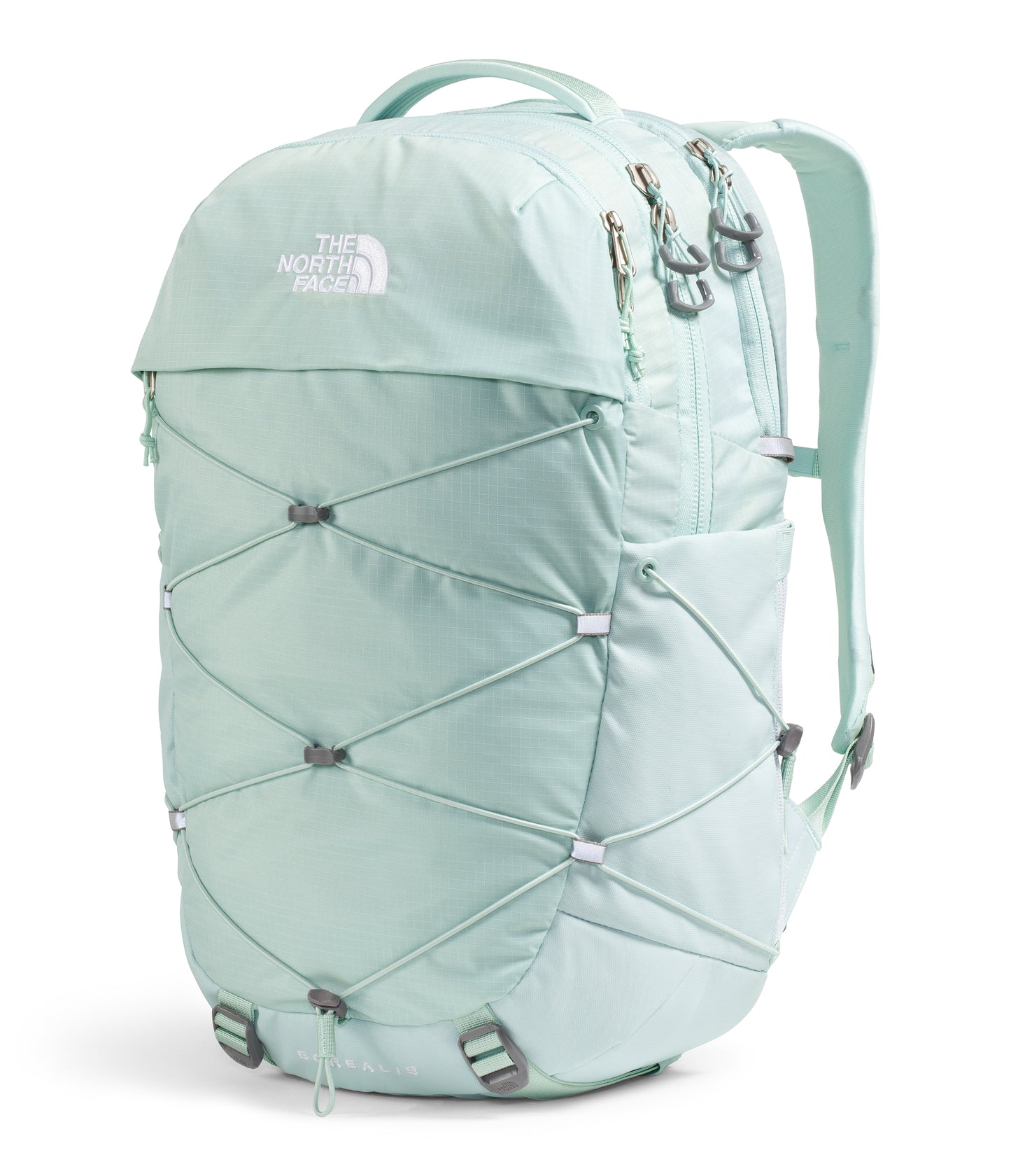 Light-green backpack with crisscrossing elastic cords, a top handle, and shoulder straps.