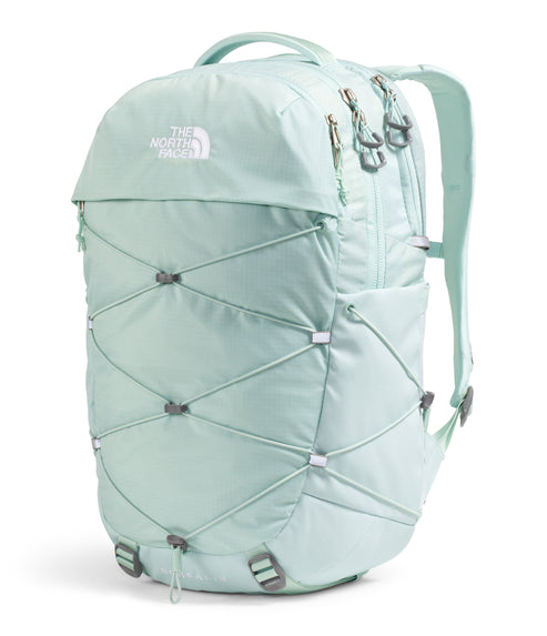 Light-green backpack with crisscrossing elastic cords, a top handle, and shoulder straps.