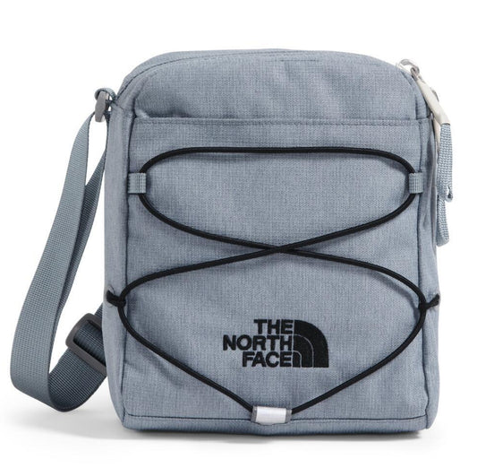 Light blue over-the-shoulder bag with black bungee cord and "THE NORTH FACE" logo.